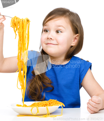 Image of Little girl is eating spaghetti