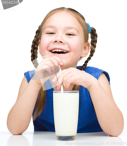 Image of Cute little girl with a glass of milk