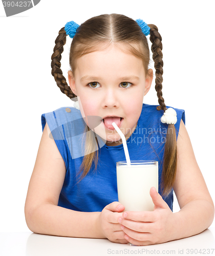 Image of Cute little girl with a glass of milk