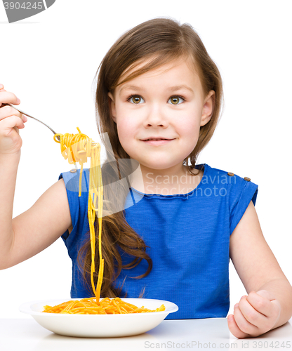 Image of Little girl is eating spaghetti