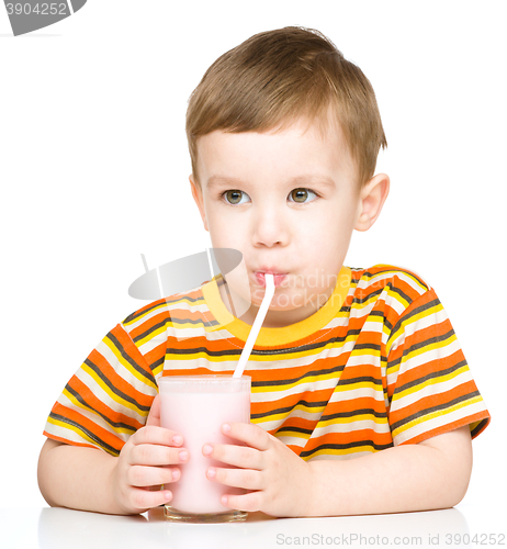 Image of Cute little boy with a glass of milk