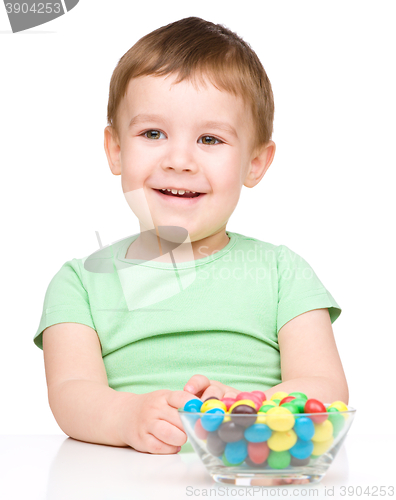 Image of Portrait of a boy with candies