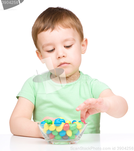 Image of Portrait of a boy with candies