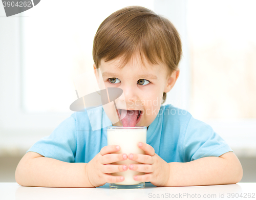 Image of Cute little boy with a glass of milk