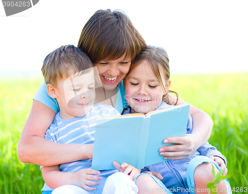 Image of Family is reading book