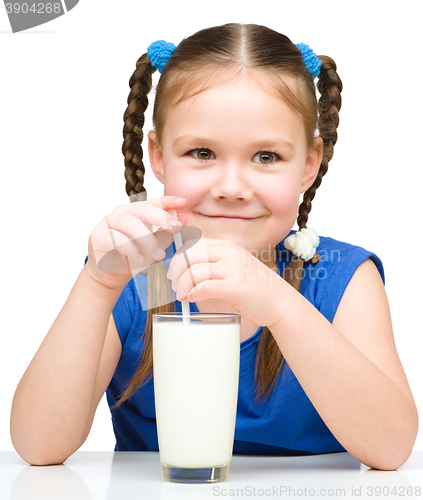 Image of Cute little girl with a glass of milk