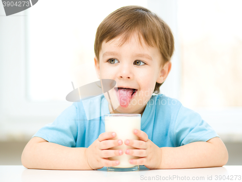 Image of Cute little boy with a glass of milk