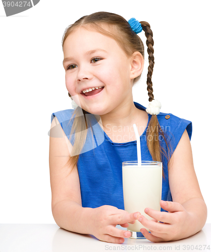 Image of Cute little girl with a glass of milk