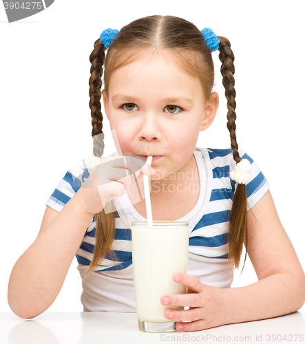 Image of Cute little girl with a glass of milk