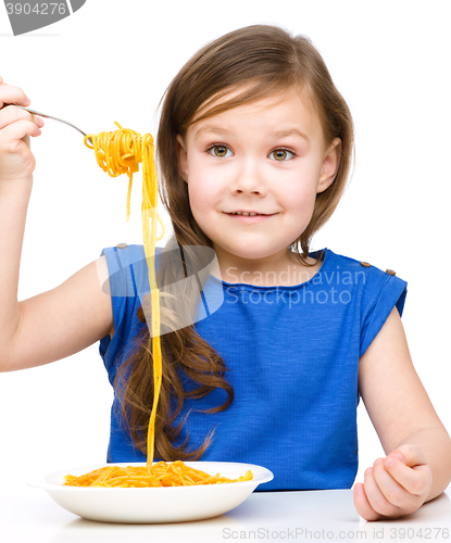 Image of Little girl is eating spaghetti