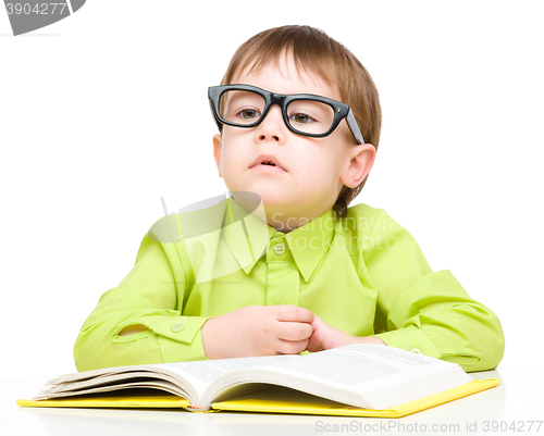 Image of Little child play with book