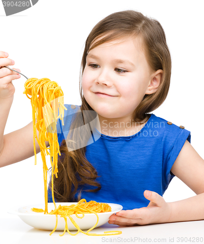 Image of Little girl is eating spaghetti