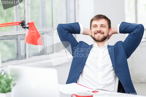 Image of The male office worker resting