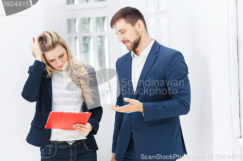 Image of Male and female office workers.