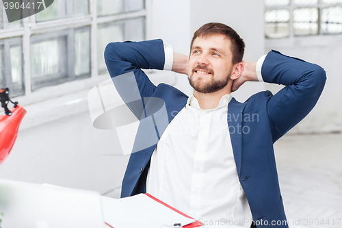 Image of The male office worker resting