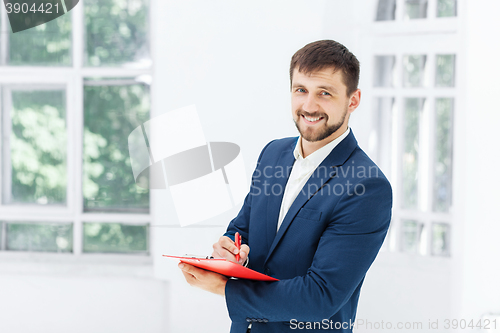 Image of The smiling male office worker