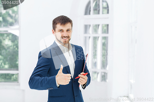 Image of The smiling male office worker