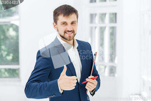 Image of The smiling male office worker