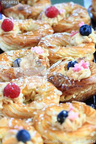 Image of cream puff with raspberries and blueberries
