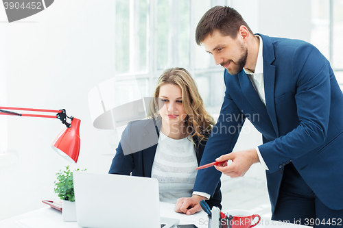 Image of Male and female office workers.