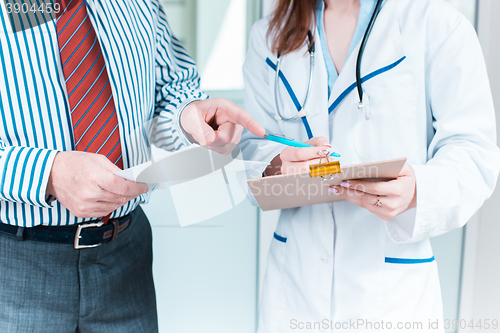 Image of Close-up of doctor and patient hands