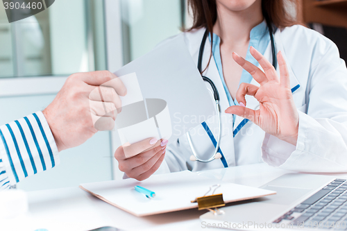 Image of The patient and his doctor in medical office