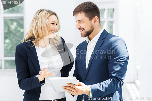 Image of Male and female office workers.