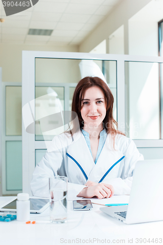 Image of Woman doctor sitting at the table