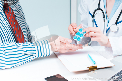 Image of The patient and his doctor in medical office