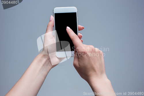 Image of Closeup shot of a woman typing on mobile phone 