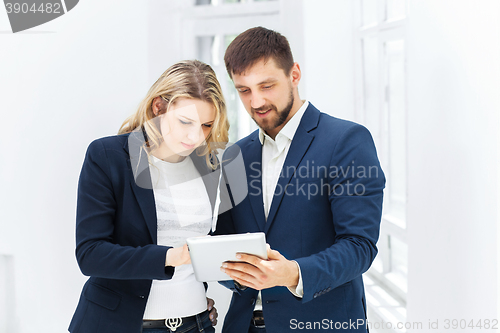 Image of Male and female office workers.