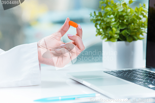 Image of The doctor with pill in hospital