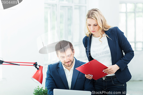 Image of Male and female office workers.