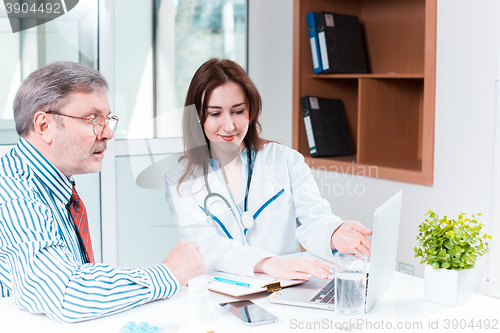 Image of The patient and his doctor in medical office