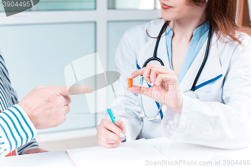 Image of The patient and his doctor in medical office