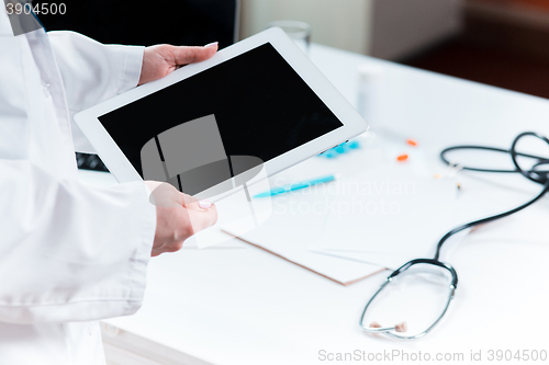 Image of Doctor working on a digital tablet