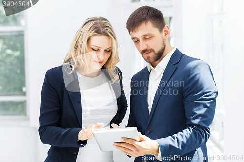 Image of Male and female office workers.