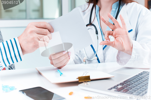 Image of The patient and his doctor in medical office