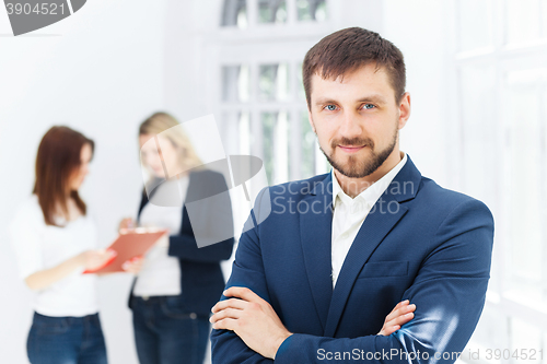 Image of Male and female office workers.