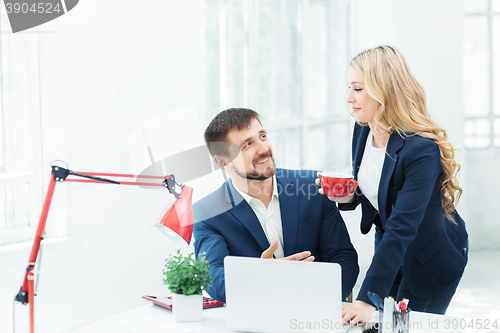 Image of Male and female office workers.