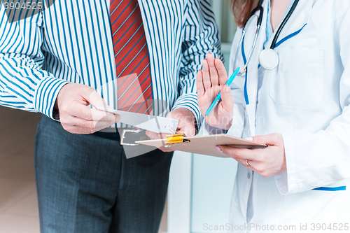 Image of Close-up of doctor and patient hands