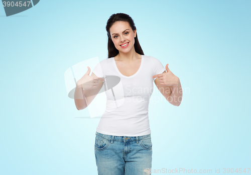 Image of happy young woman or teenage girl in white t-shirt