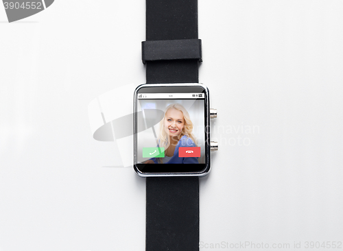 Image of close up of black smart watch with incoming call