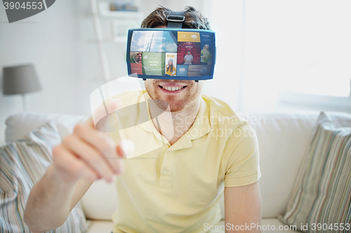 Image of young man in virtual reality headset or 3d glasses