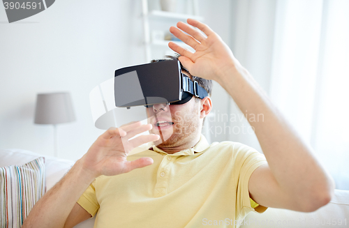 Image of young man in virtual reality headset or 3d glasses