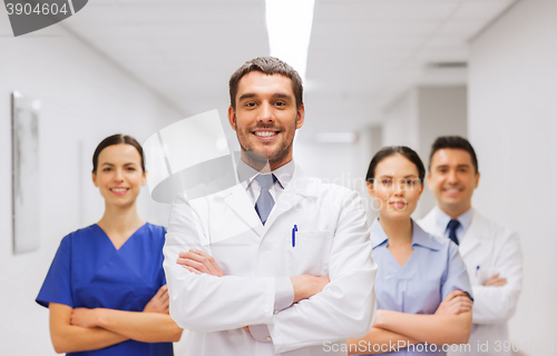 Image of happy group of medics or doctors at hospital