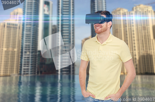 Image of happy man in virtual reality headset or 3d glasses