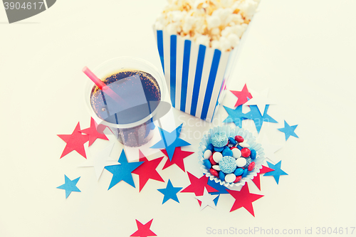 Image of cola and popcorn with candies on independence day