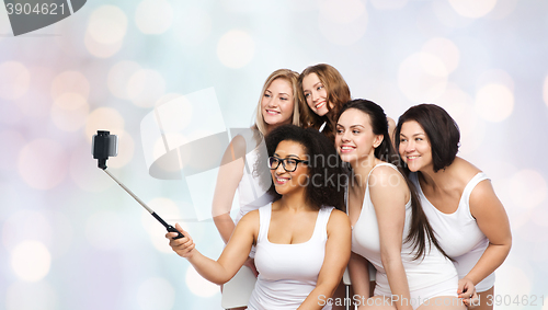 Image of group of happy women taking selfie by smartphoone