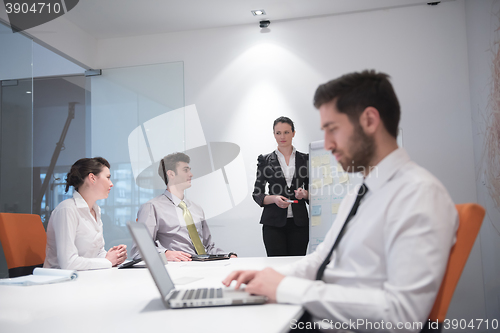 Image of young business man at meeting